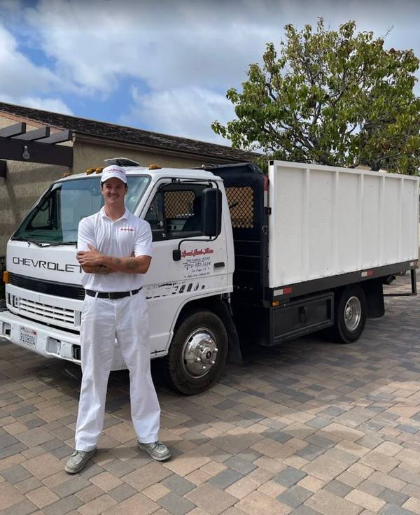 Shane Connor — Owner of Local JunkMan with his junk removal truck in San Diego